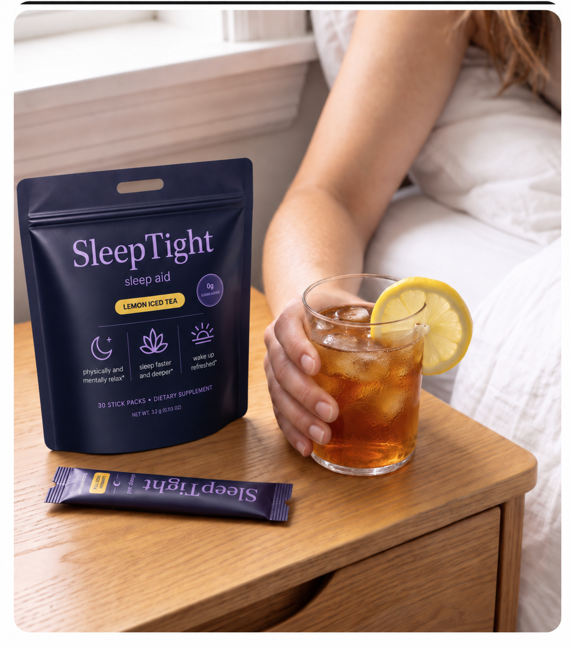 SleepTight pouch and stick pack beside a Lemon Iced Tea on a bedroom nightstand
